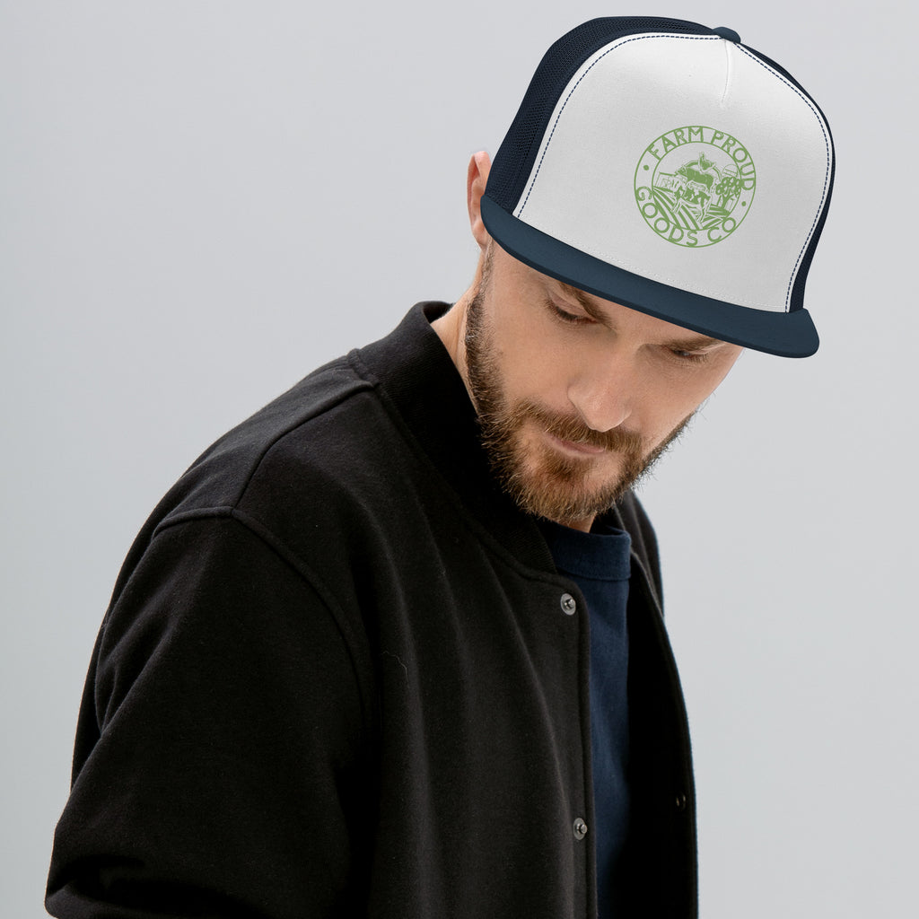 navy and white Farm Proud Goods trucker hat with green circular farm logo featuring livestock, fields, barn, and trees on the front.