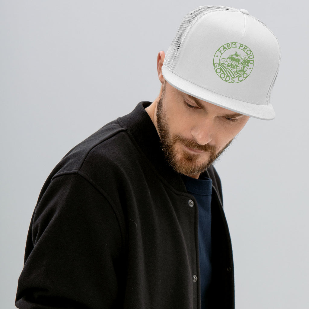 white Farm Proud Goods trucker hat with green circular farm logo featuring livestock, fields, barn, and trees on the front.